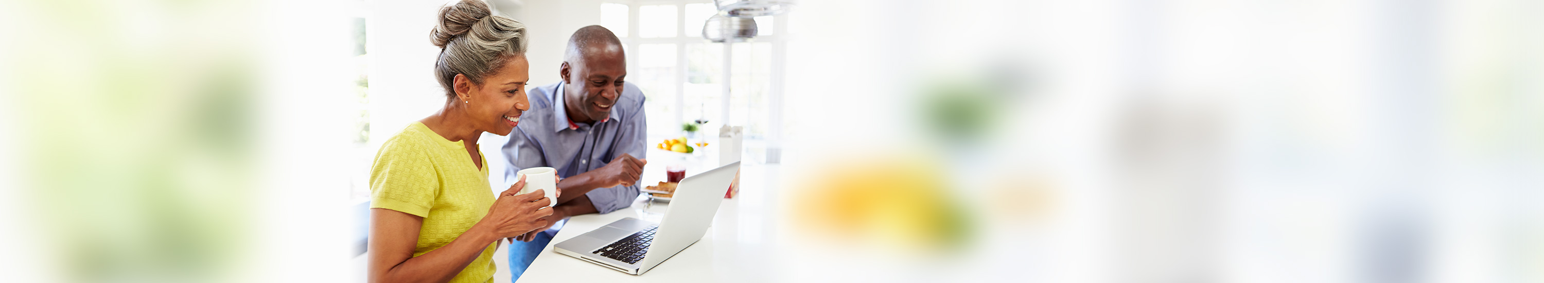 Woman and man using laptop