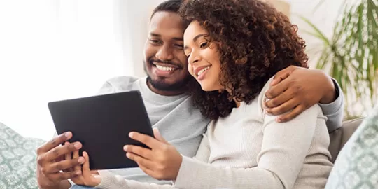 Couple looking at tablet